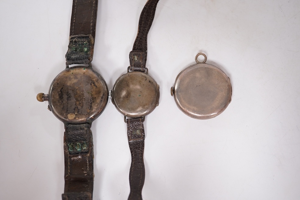 An early 20th century silver Borgel cased manual wind wrist watch(a.f.), one other similar silver half hunter manual wind wrist watch(no strap) and one other similar with a strap. Condition - poor